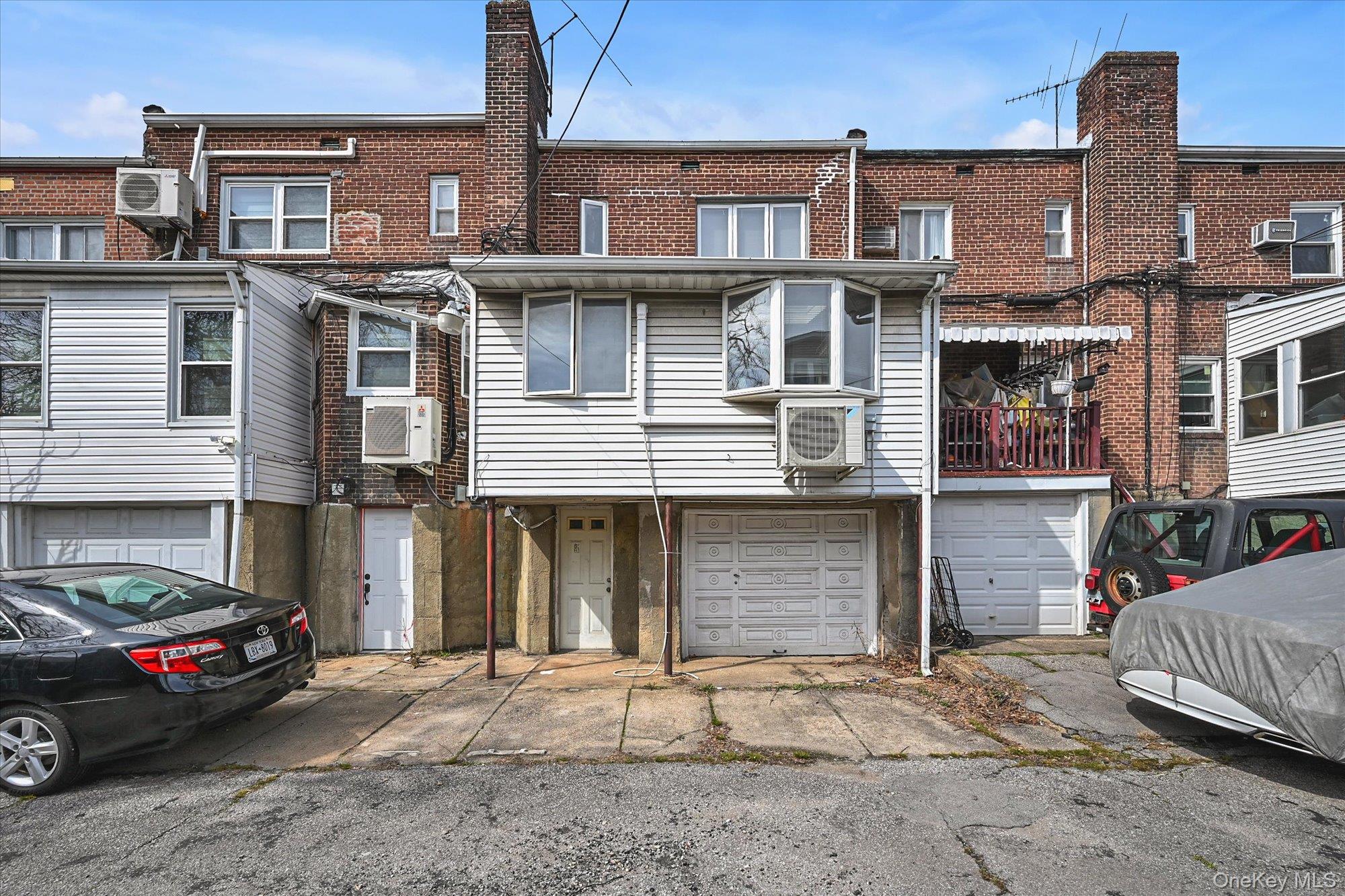 136-54 71st Road Queens, NY 11367 - Photo 25 of 25 a front view of a house with a yard
