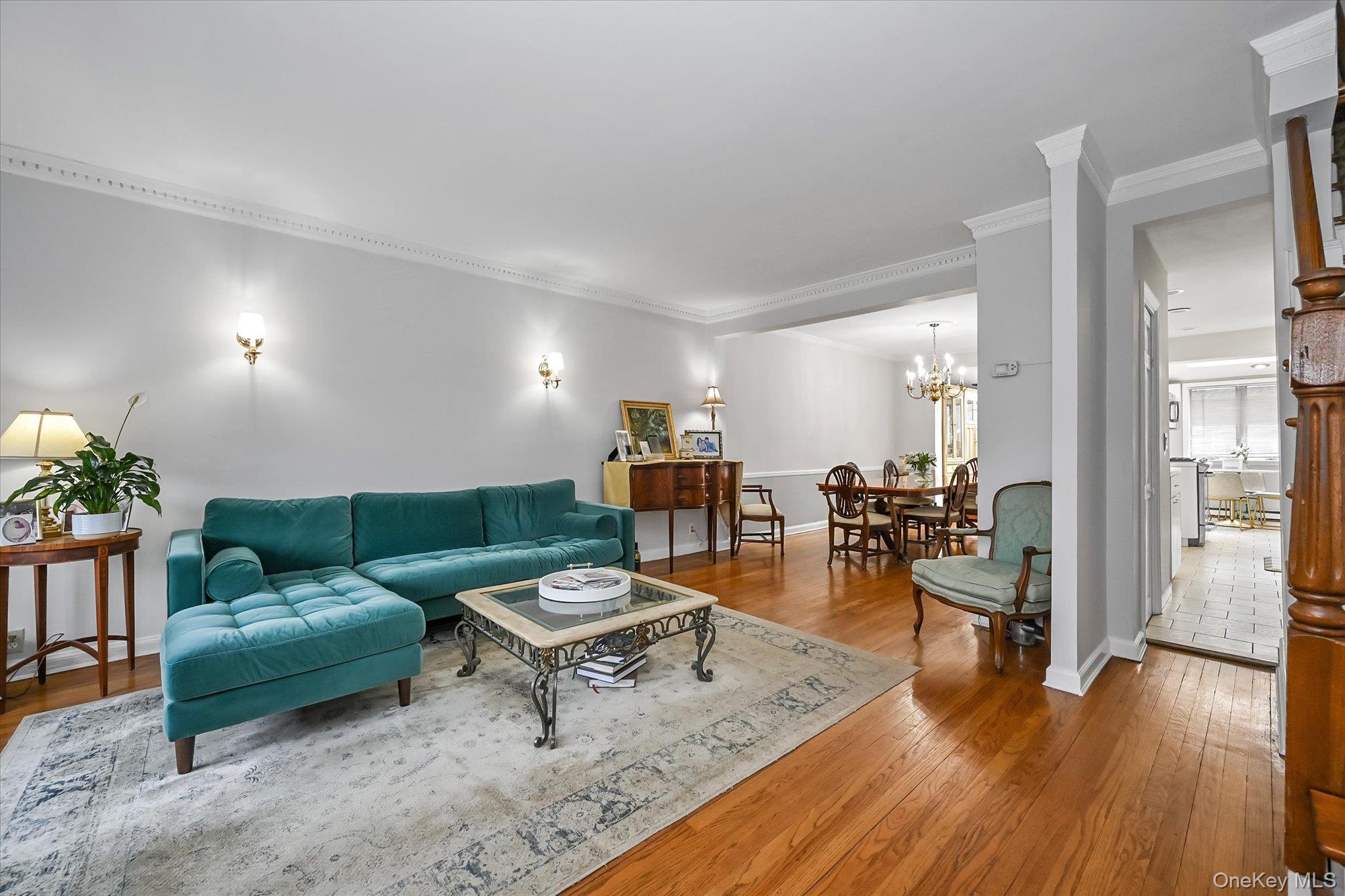 136-54 71st Road Queens, NY 11367 - Photo 3 of 25 a living room with furniture and wooden floor