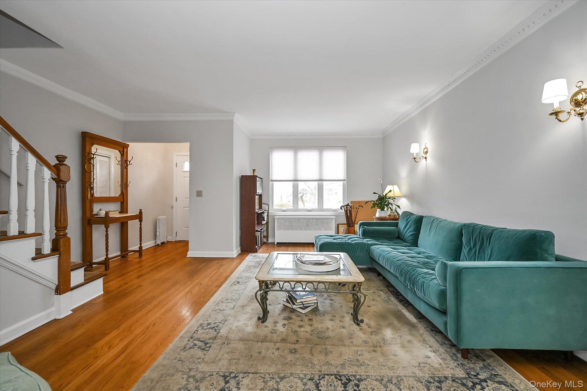 136-54 71st Road Queens, NY 11367 - Photo 4 of 25 a living room with furniture and a rug