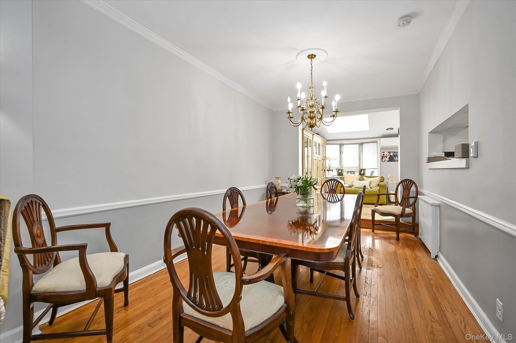 136-54 71st Road Queens, NY 11367 - Photo 6 of 25 a view of a dining room with furniture window and wooden floor