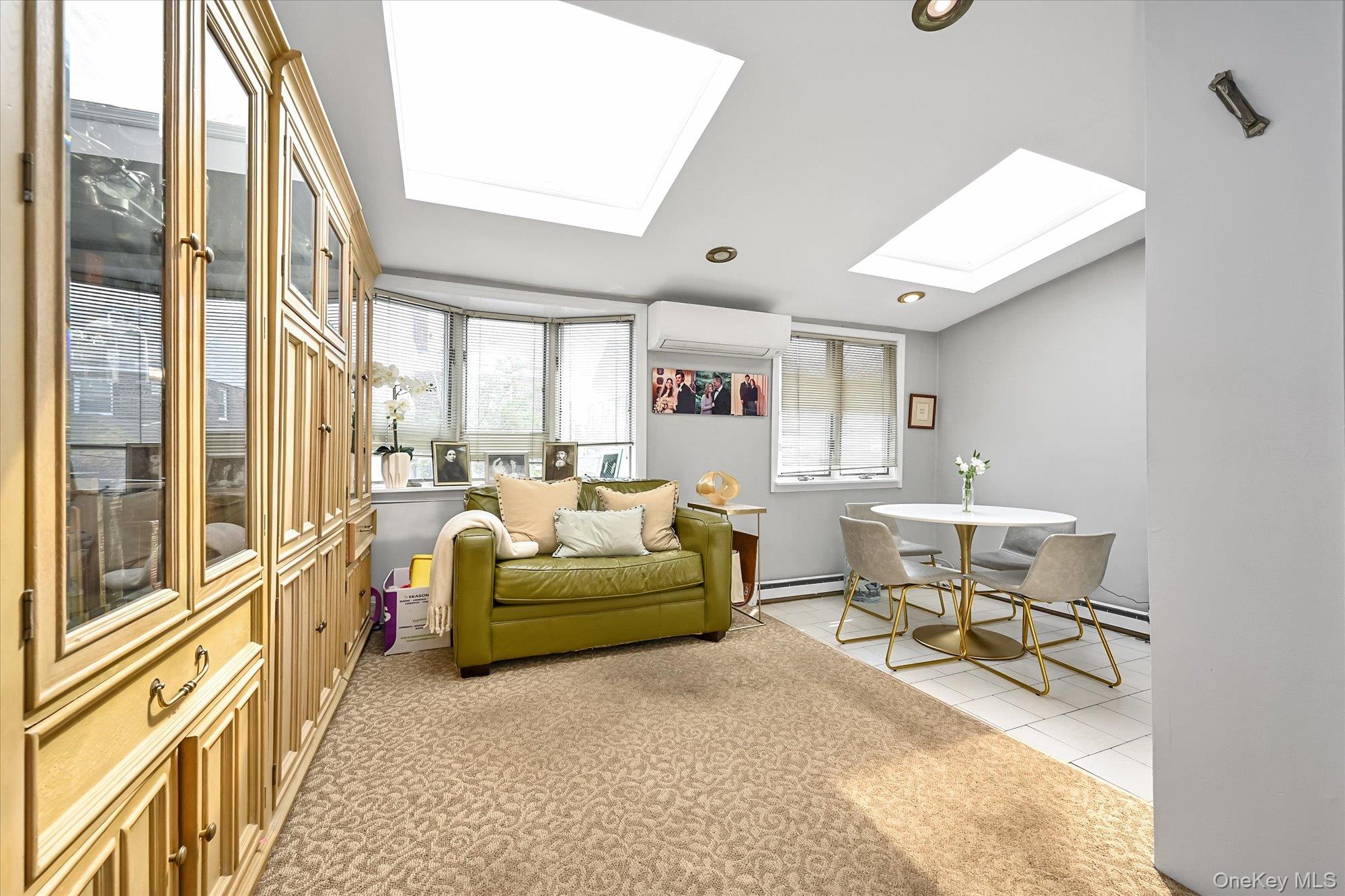 136-54 71st Road Queens, NY 11367 - Photo 8 of 25 a living room with furniture and a window