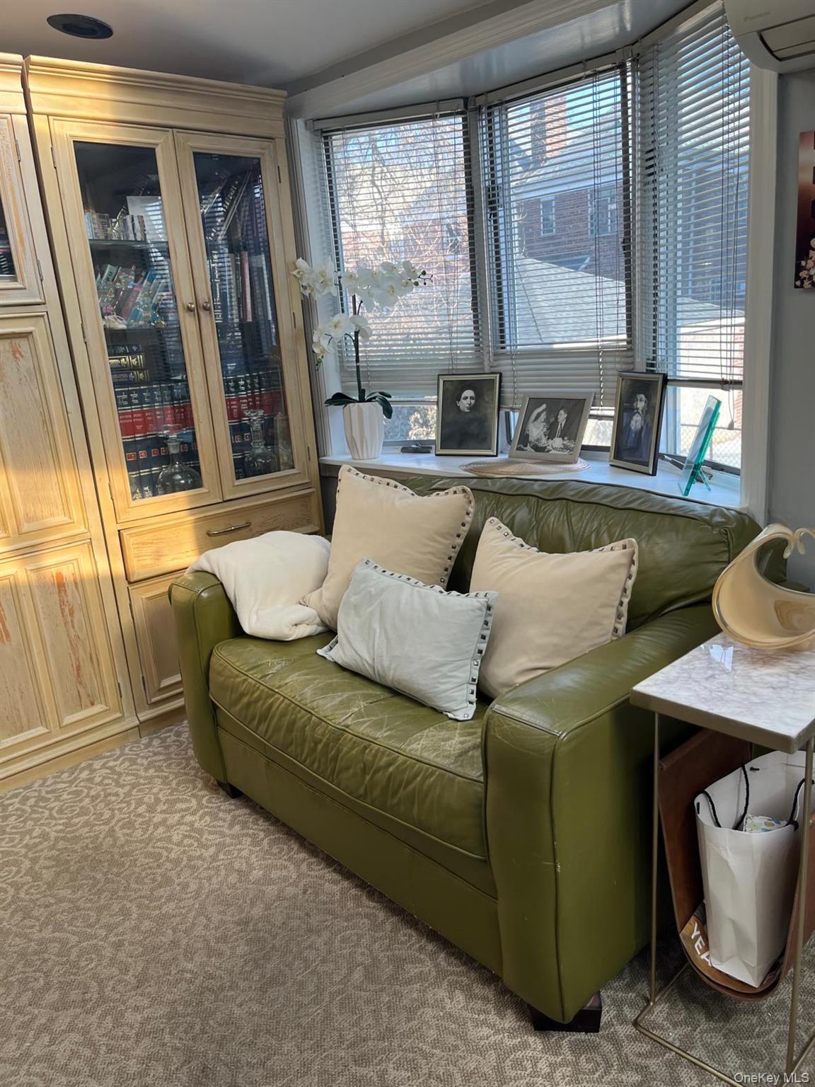136-54 71st Road Queens, NY 11367 - Photo 9 of 25 a living room with furniture and a large window