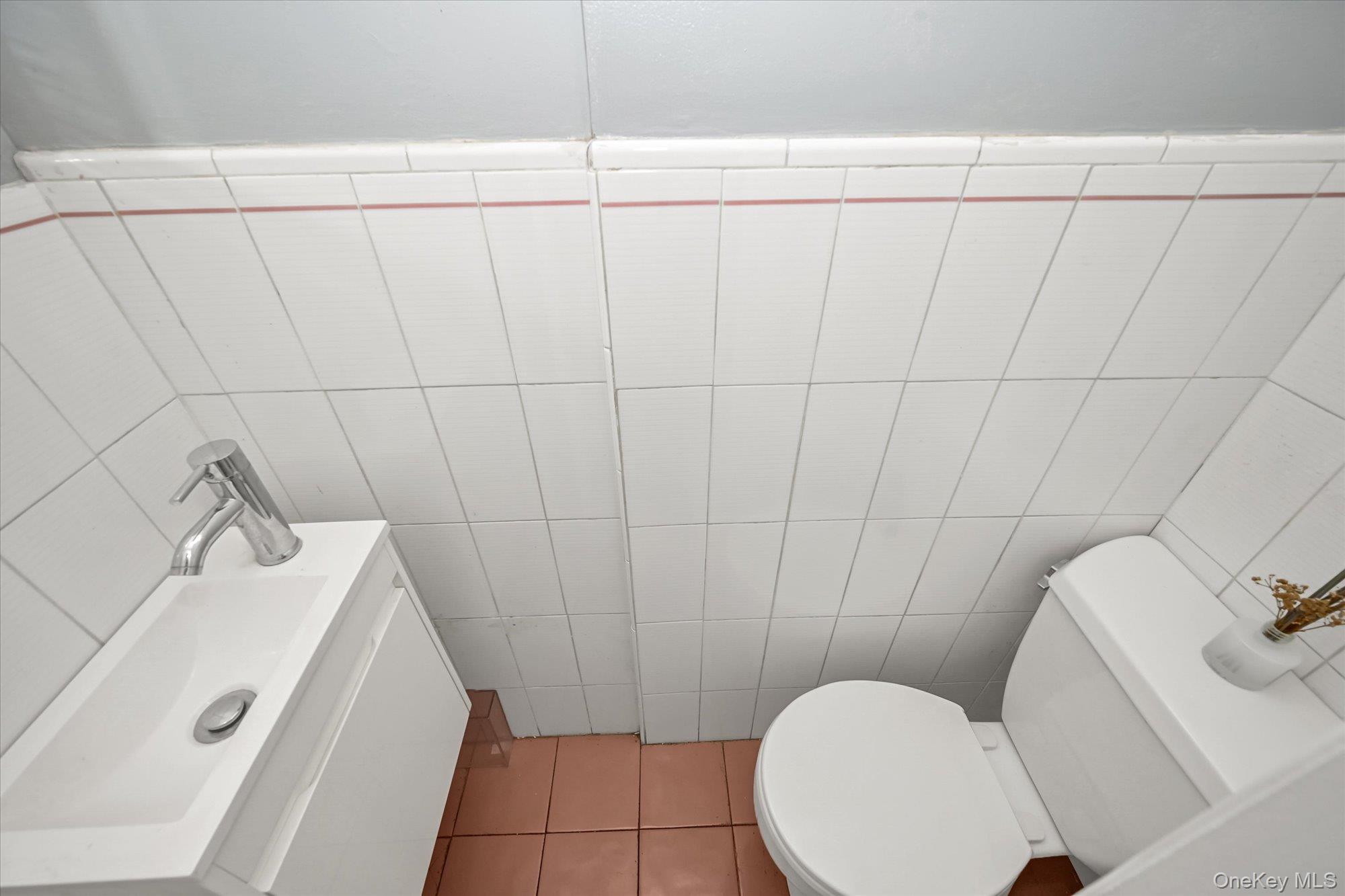 136-54 71st Road Queens, NY 11367 - Photo 10 of 25 a bathroom with a sink and toilet