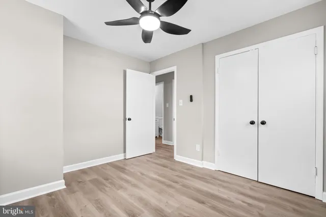 a view of an empty room and wooden floor
