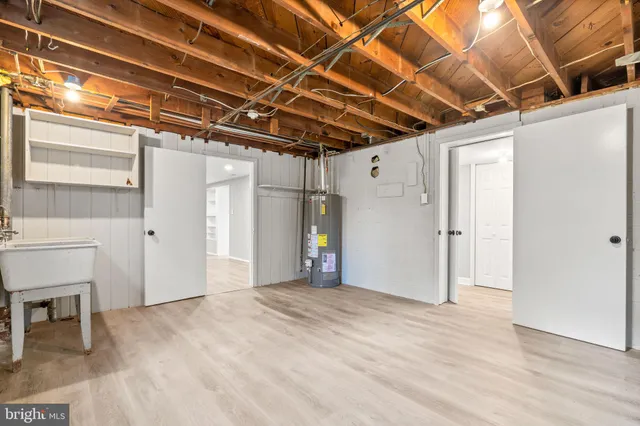 a view of a room with wooden walls