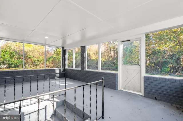 a view of entry way with wooden door