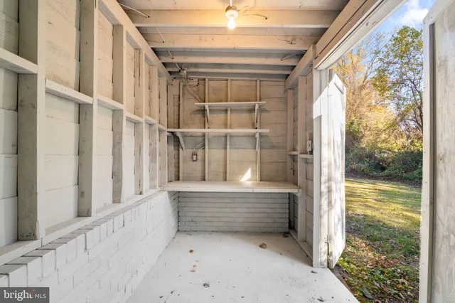 a view of a house with a big yard and a large tree