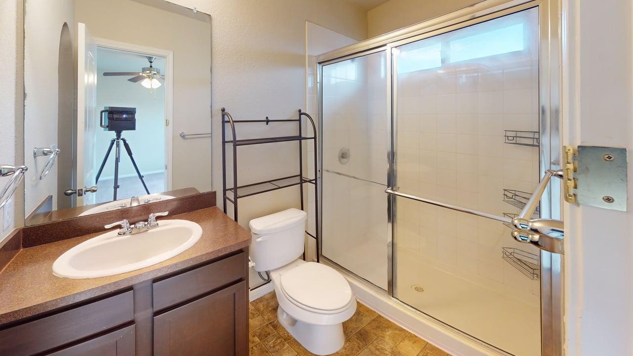 4621 Kind Way, Unit 271 Austin, TX 78742 - Photo 11 of 11 Full bath with vanity, a stall shower, and ceiling fan