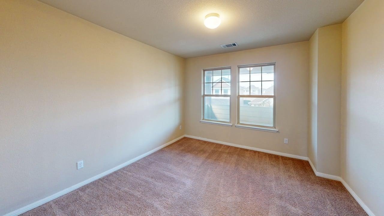 4621 Kind Way, Unit 271 Austin, TX 78742 - Photo 9 of 11 Carpeted spare room featuring baseboards