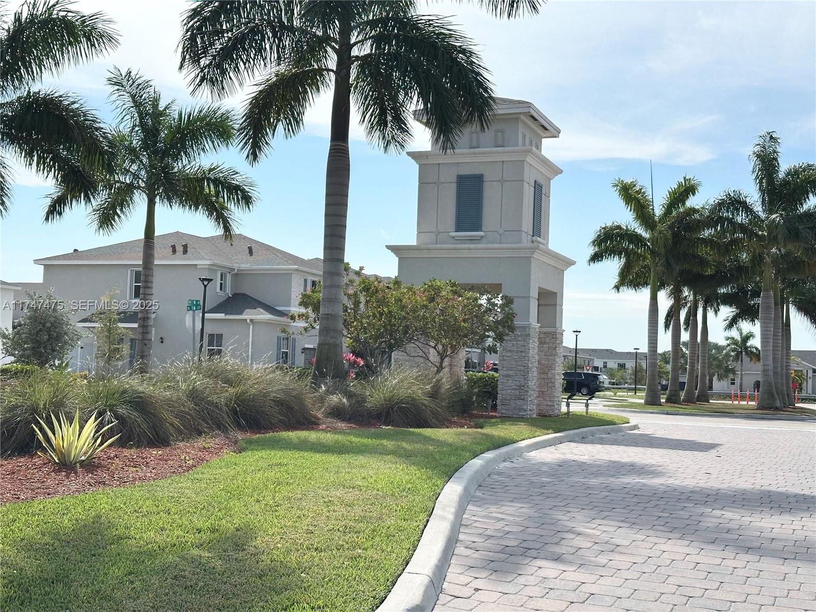 1848 Southeast 7th Street, Unit 1848 Homestead, FL 33033 - Photo 3 of 29 a view of a palm trees in front of a house