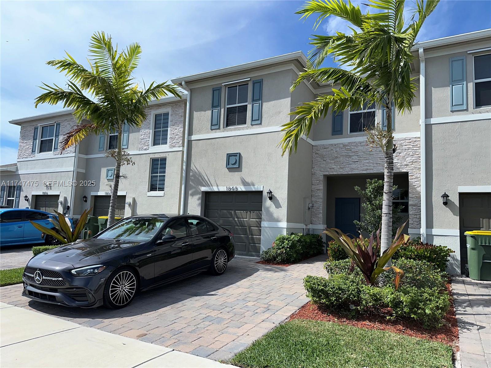 1848 Southeast 7th Street, Unit 1848 Homestead, FL 33033 - Photo 8 of 29 a car parked in front of a house