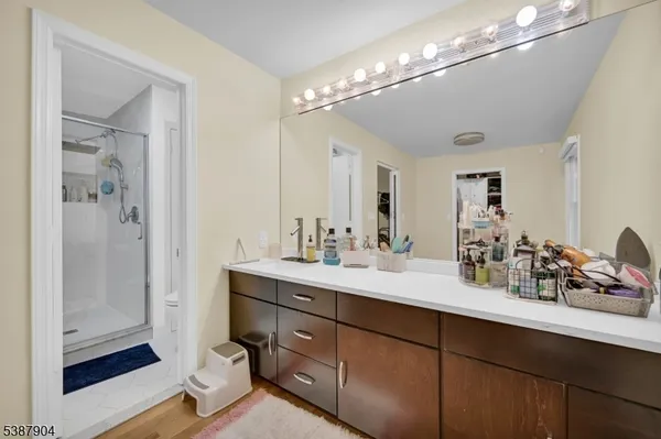 a bathroom with a sink double vanity and shower