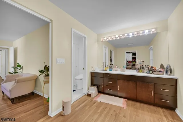a spacious bathroom with a double vanity sink and a mirror