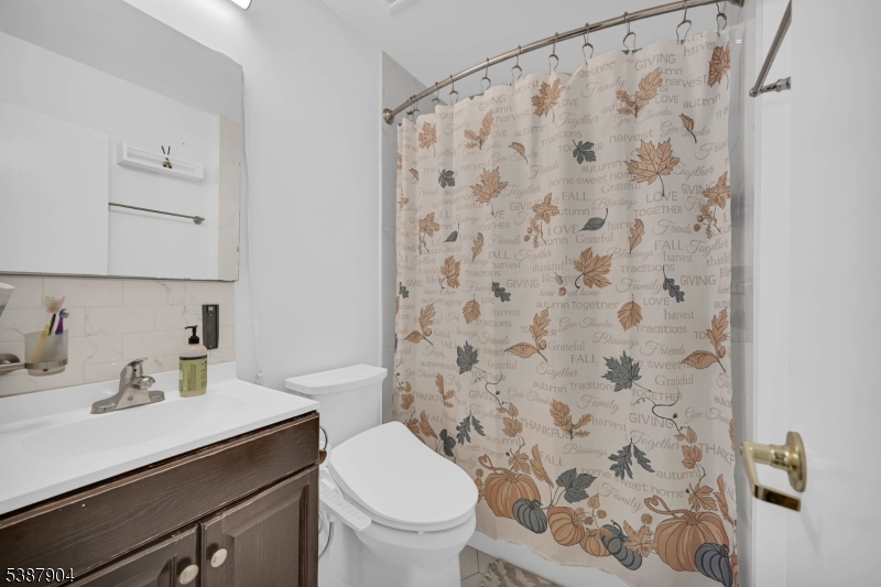 30 County Rte 635 Livingston, NJ 07039 - Photo 15 of 40 a bathroom with a sink toilet and shower