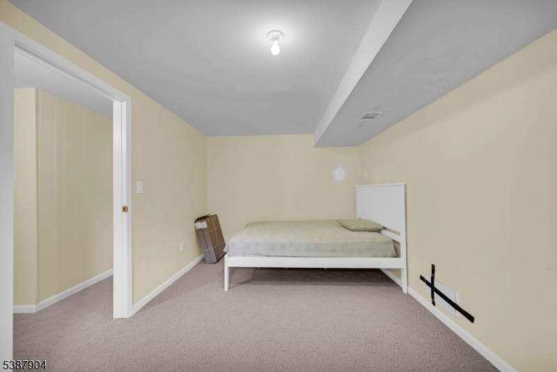 30 County Rte 635 Livingston, NJ 07039 - Photo 18 of 40 a bedroom with bed and window