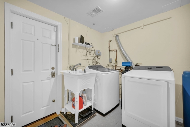 30 County Rte 635 Livingston, NJ 07039 - Photo 21 of 40 a utility room with dryer and washer