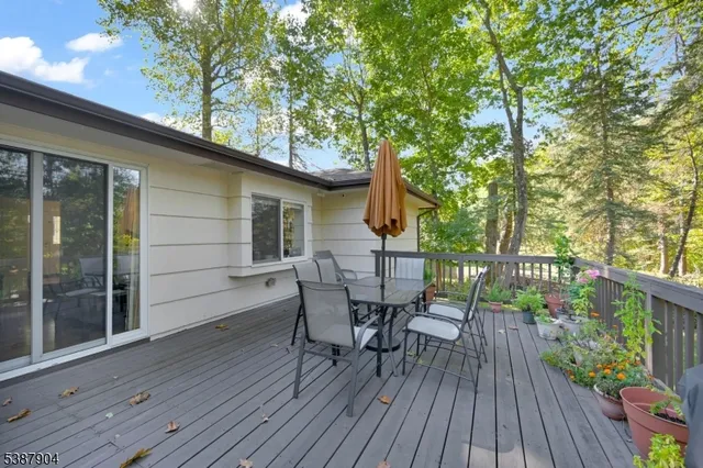 a view of a house with patio and wooden floor