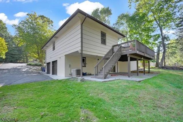 a front view of house with a garden and patio