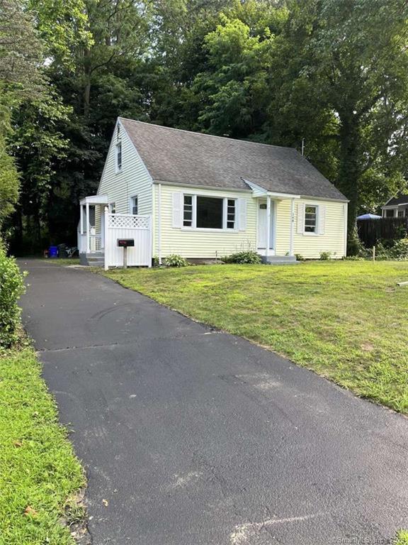 168 Spring Street Windsor Locks, CT 06096 - Photo 1 of 1 a front view of a house with a yard and garage