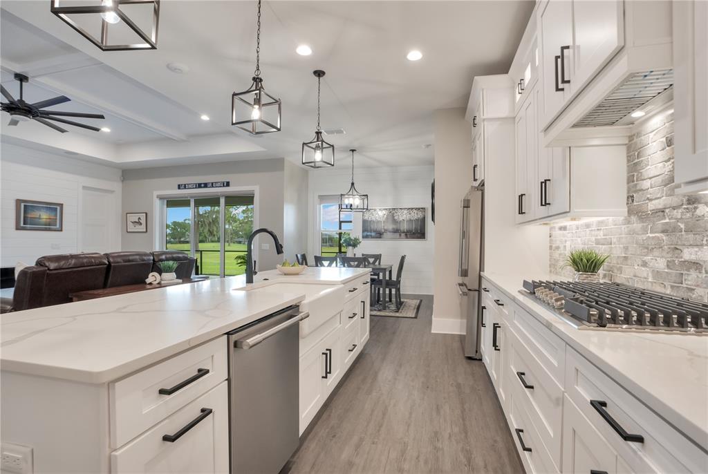 440 Palma Ceia Road Winter Haven, FL 33884 - Photo 14 of 78 a large white kitchen with a stove and refrigerator