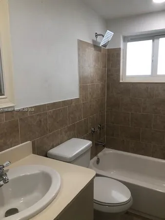 a bathroom with a sink and toilet