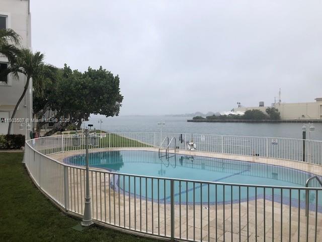 7905 East Drive, Unit 9C North Bay Village, FL 33141 - Photo 3 of 11 a terrace with outdoor seating and city view