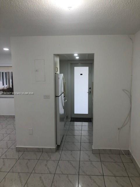 7905 East Drive, Unit 9C North Bay Village, FL 33141 - Photo 9 of 11 a view of a hallway with closet and wooden floor