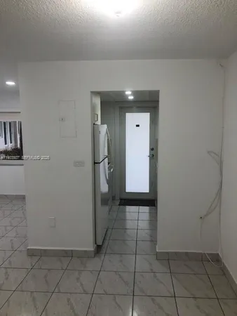 a view of a hallway with some storage area