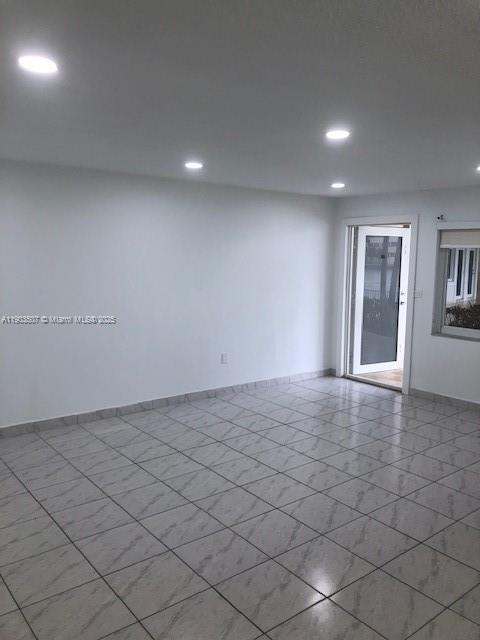 7905 East Drive, Unit 9C North Bay Village, FL 33141 - Photo 10 of 11 an empty room with windows