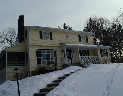 7 Valley View Road Newtown, CT 06470 - Photo 1 of 1 a front view of a house with a yard and garage