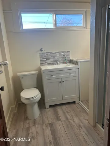 a bathroom with a toilet and a sink