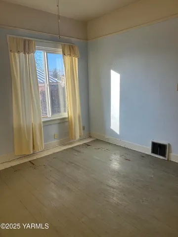 a view of a hallway with wooden shelves