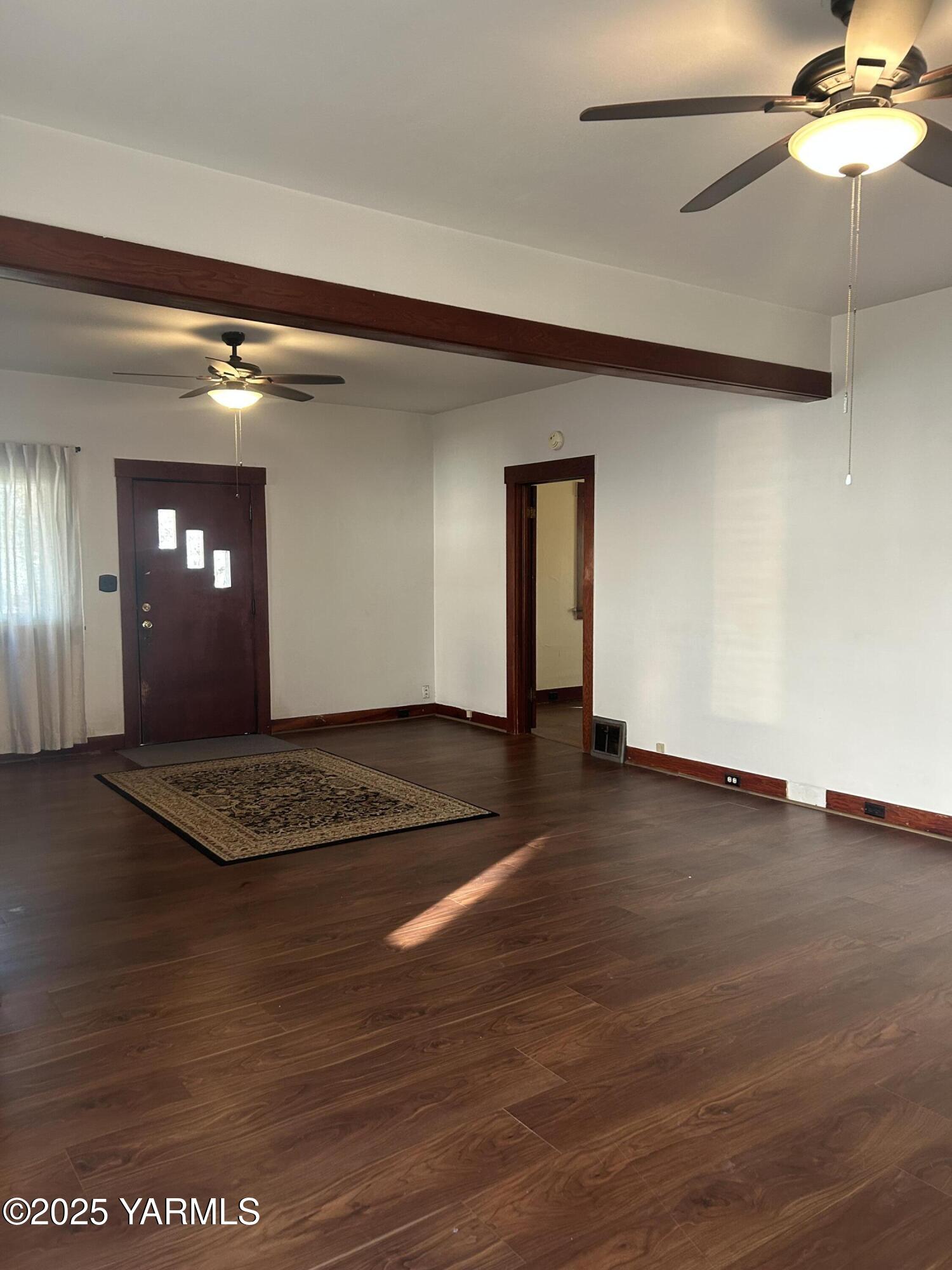 1110 South 8th Avenue Yakima, WA 98902 - Photo 2 of 25 a view of livingroom with hardwood floor and a ceiling fan