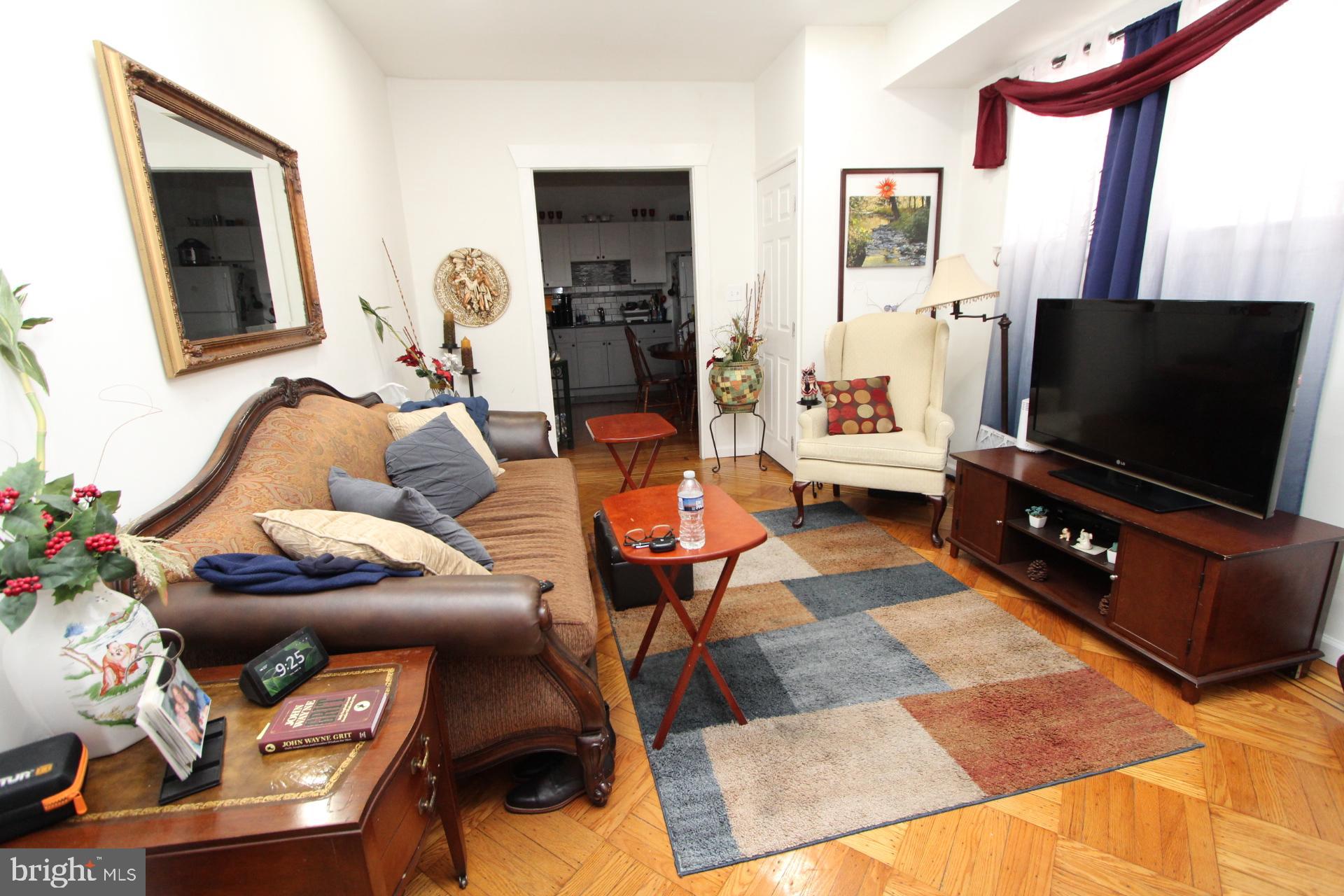 2311 Rhawn Street Philadelphia, PA 19152 - Photo 20 of 34 a living room with furniture and a flat screen tv