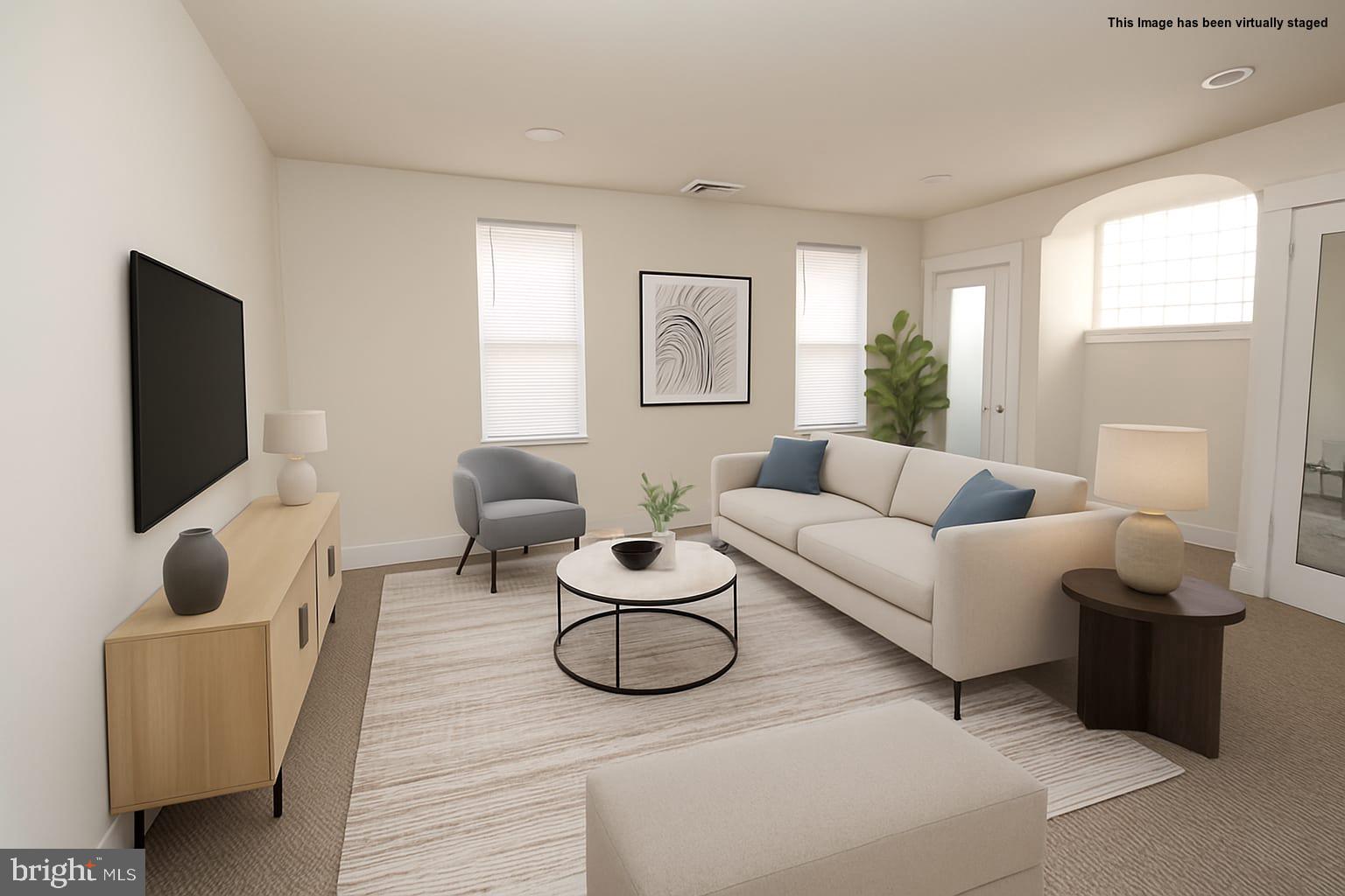 2311 Rhawn Street Philadelphia, PA 19152 - Photo 7 of 34 a living room with furniture and a flat screen tv