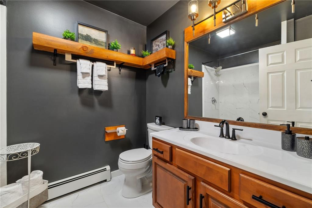 147 Fike Lane Addison, PA 15411 - Photo 42 of 50 a bathroom with a sink a toilet and mirror