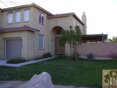37411 Rutland Street Indio, CA 92203 - Photo 2 of 7 a front view of a house with a garden