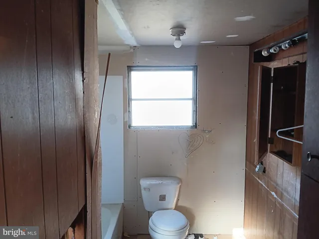 a bathroom with a toilet and a sink