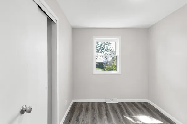 a bathroom with a granite countertop toilet and a shower