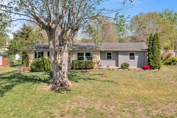 front view of a house with a yard