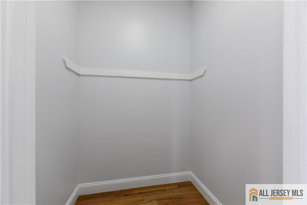 452 Raritan Boulevard Old Bridge, NJ 07735 - Photo 11 of 29 a view of a room with racks on the wall