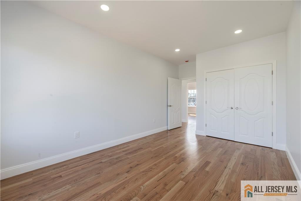 452 Raritan Boulevard Old Bridge, NJ 07735 - Photo 16 of 29 a view of an empty room with wooden floor