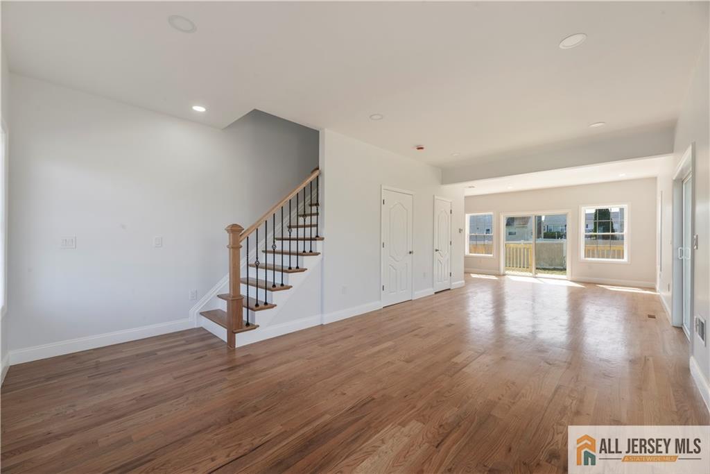 452 Raritan Boulevard Old Bridge, NJ 07735 - Photo 17 of 29 a view of an empty room with wooden floor and windows