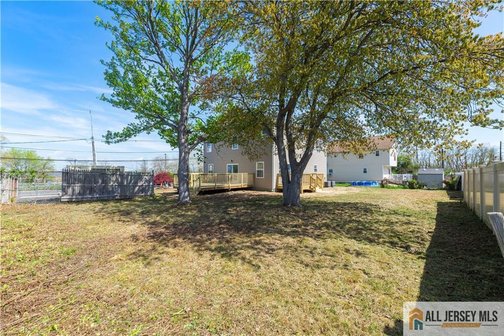 452 Raritan Boulevard Old Bridge, NJ 07735 - Photo 24 of 29 a view of a yard with a tree