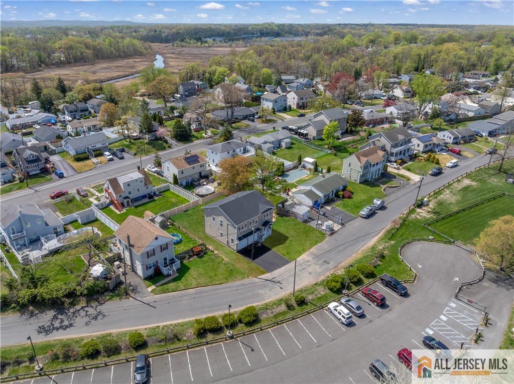 452 Raritan Boulevard Old Bridge, NJ 07735 - Photo 26 of 29 an aerial view of a city with lots of residential buildings ocean and mountain view in back