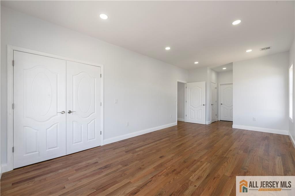 452 Raritan Boulevard Old Bridge, NJ 07735 - Photo 9 of 29 a view of an empty room with wooden floor