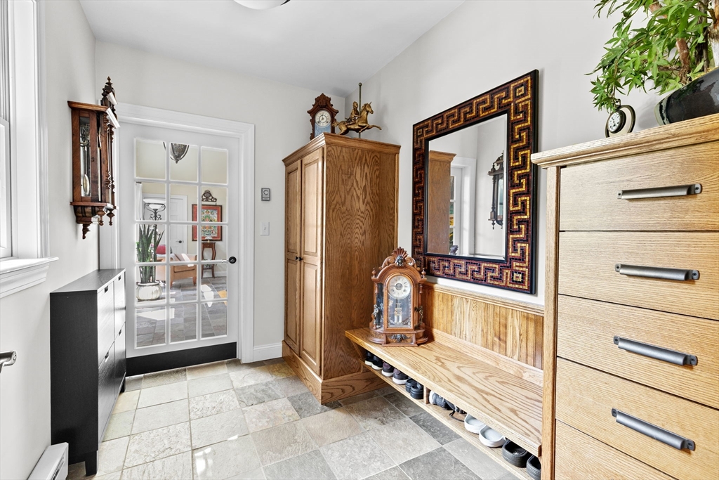 22 Marcus Road Sharon, MA 02067 - Photo 16 of 42 a view of a hallway with closet and cabinet