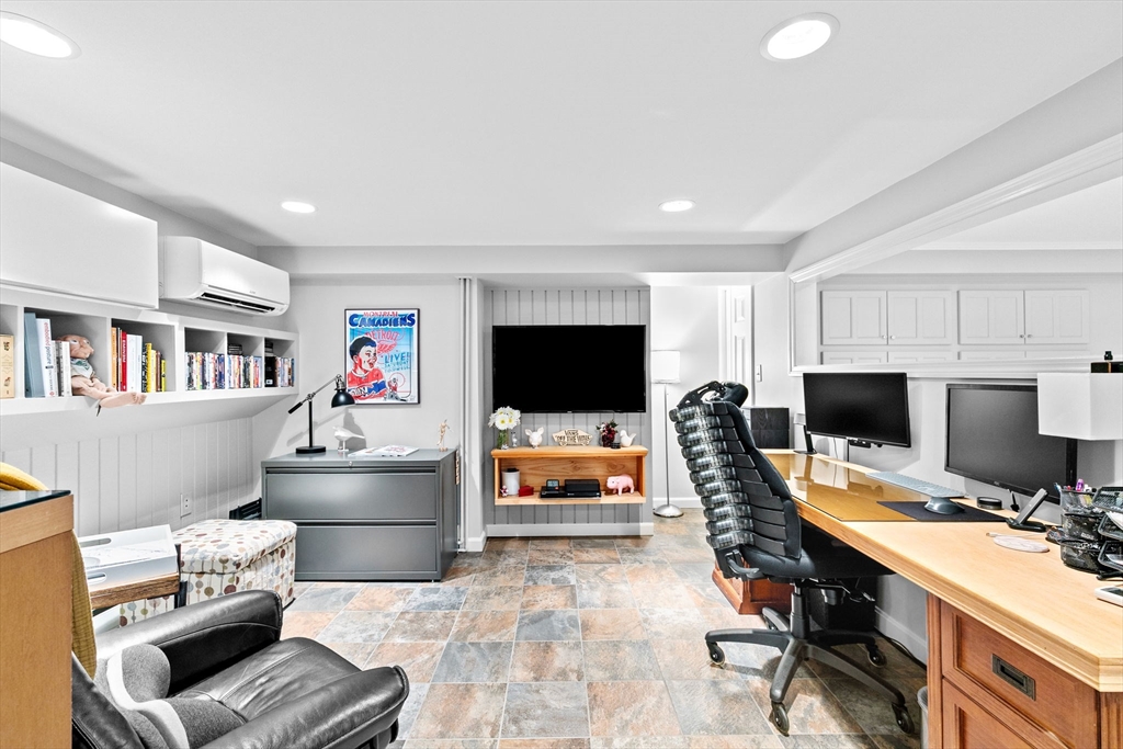 22 Marcus Road Sharon, MA 02067 - Photo 19 of 42 a workspace with furniture and a flat screen tv