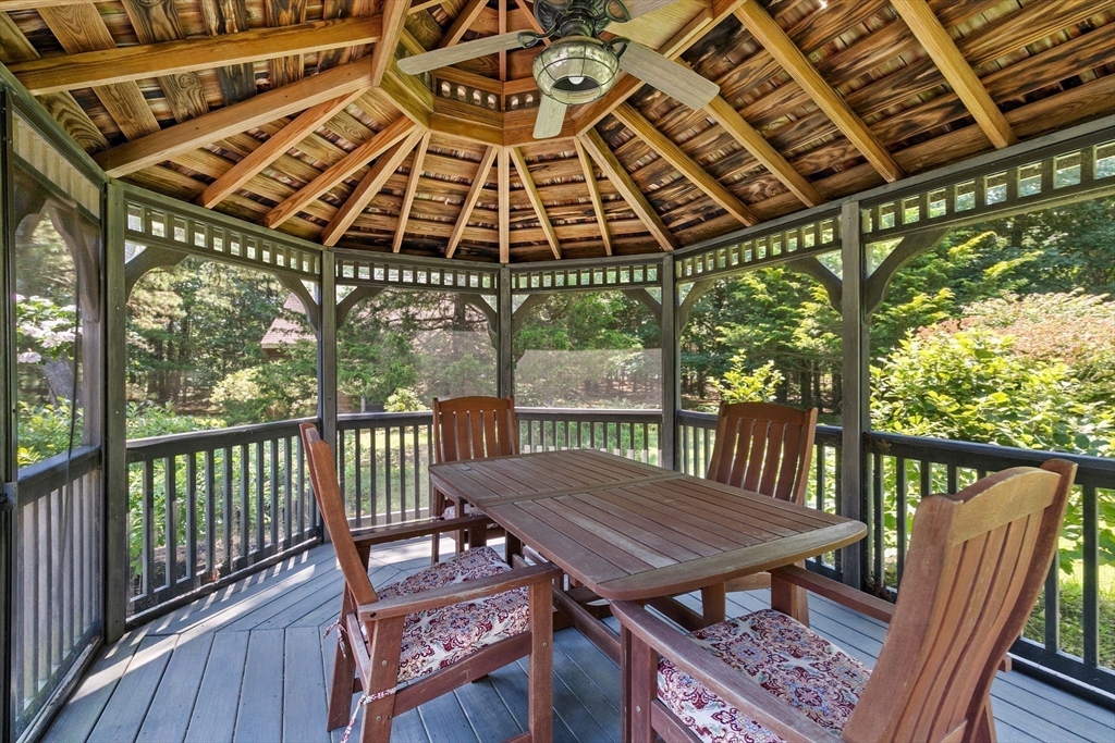 22 Marcus Road Sharon, MA 02067 - Photo 36 of 42 a roof deck with a table and chairs