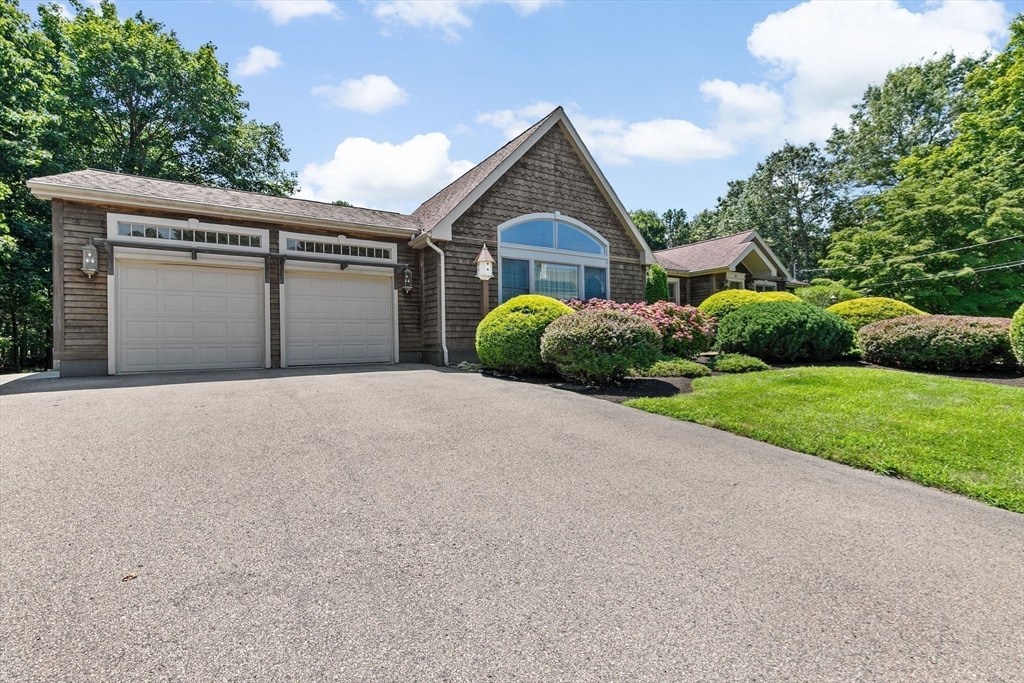 22 Marcus Road Sharon, MA 02067 - Photo 37 of 42 a front view of a house with garden